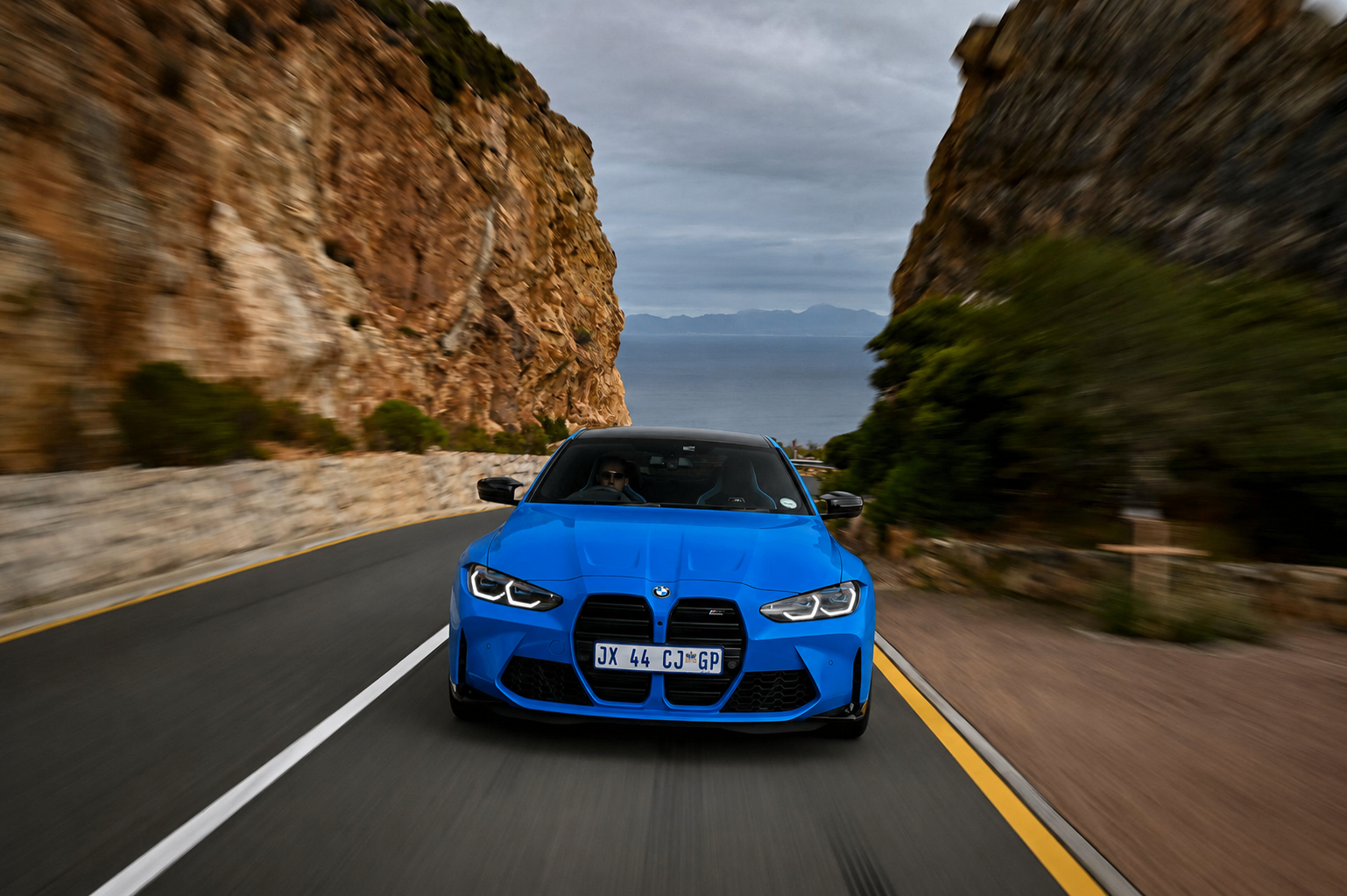 BMW M4 on coastal mountain pass